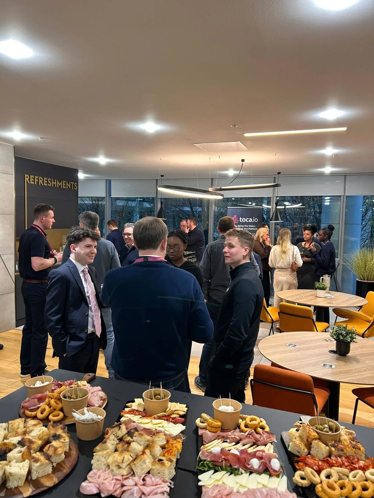 Guests talking over Madoo's charcuterie before the tasting